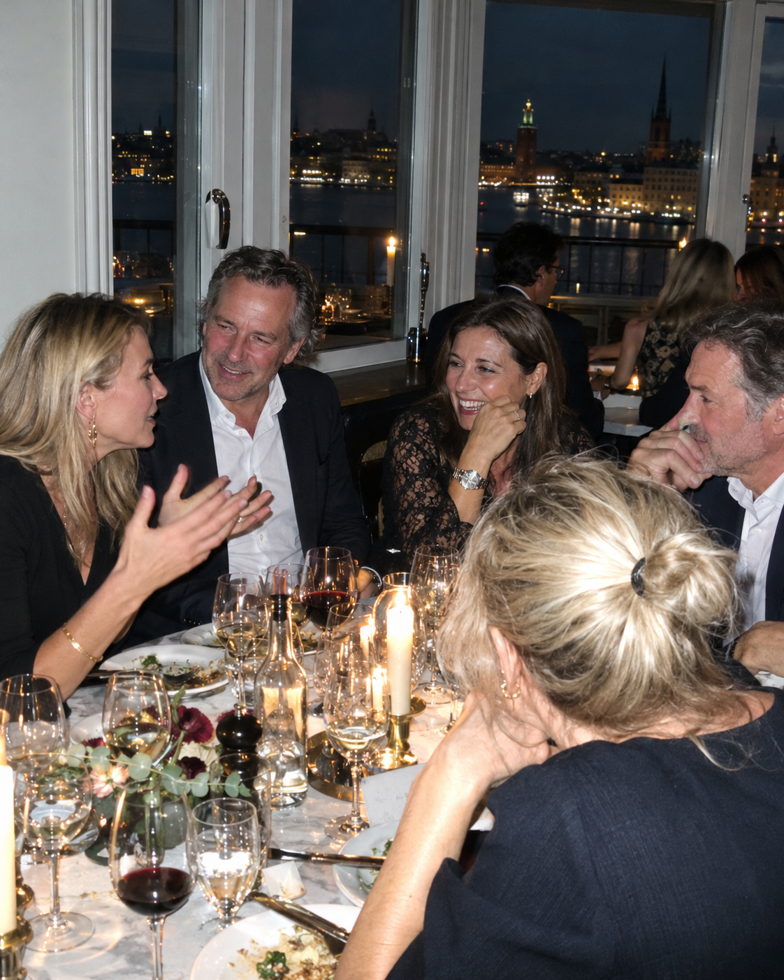 Photograph of a host introducing two guests at a gathering